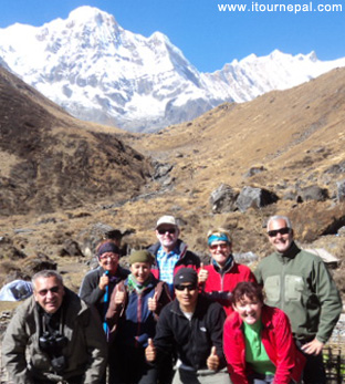 Trekking group on the way to Annapurna Base camp, in front of Annapurna South