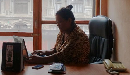 Female tourism entrepreneur Kopila Sen working at office of iTourNepal.com P Ltd