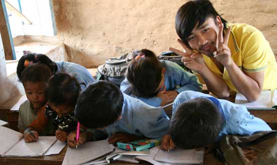 Volunteers working with kids in primary school